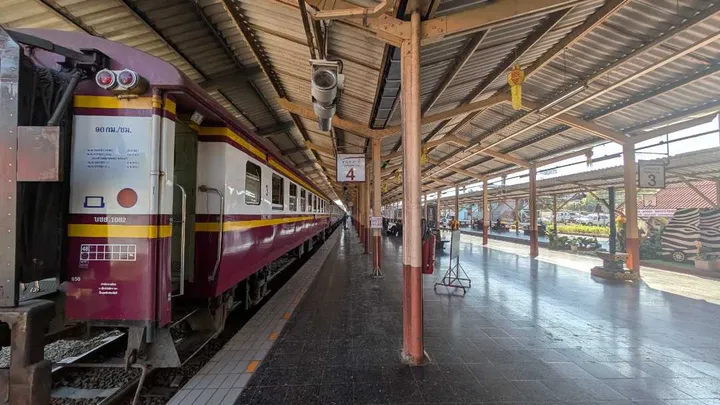 A landscape picture of a platform at a train station