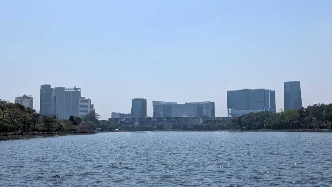 Skyscrapers overlooking the water at Benchakitti park