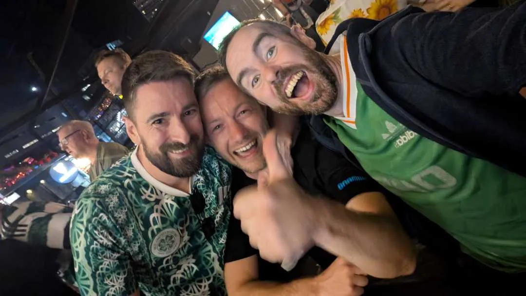 3 lads celebrating a football result