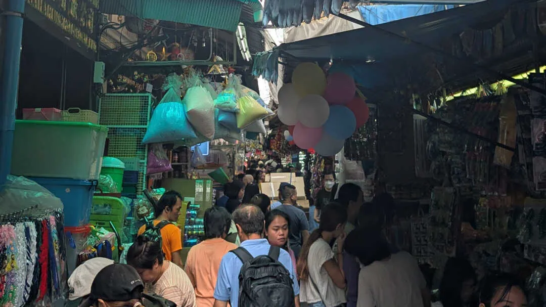 A narrow market with stalls either side