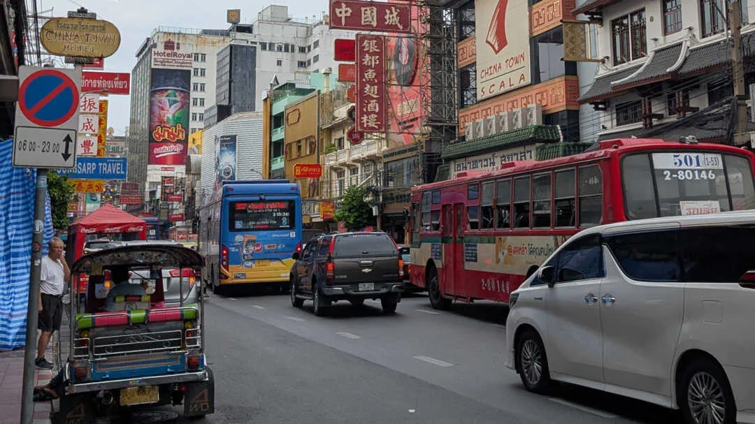A street view with advertising boards about the place