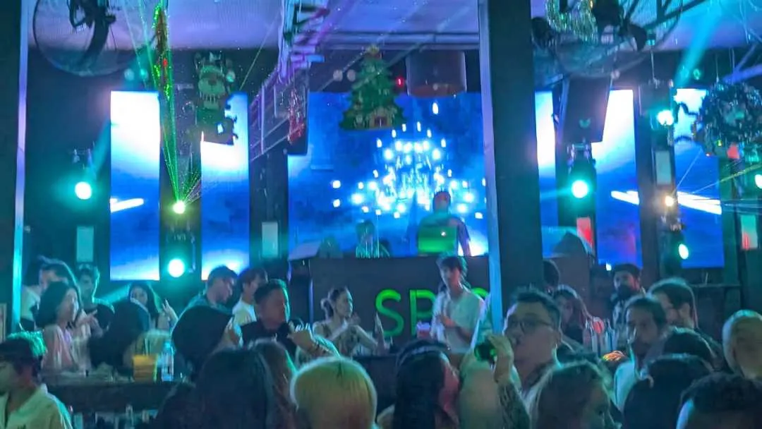 A busy dancefloor in a tacky nightclub