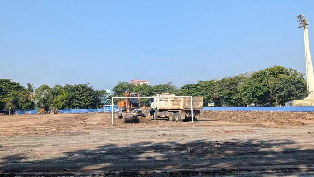 A football pitch and running track that has been dug up