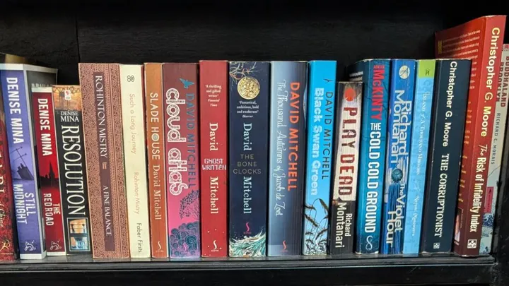 A bunch of books on a bookshelf