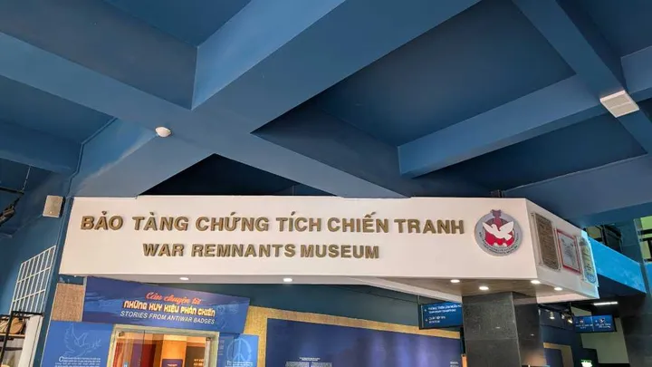 A sign saying War Remnants Museum within the main lobby of the museum