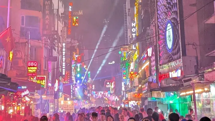 A busy bar street in Ho Chi Minh City at night