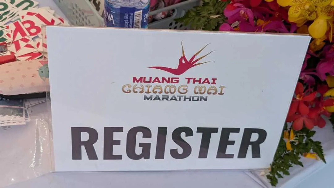 A sign showing registration for a marathon