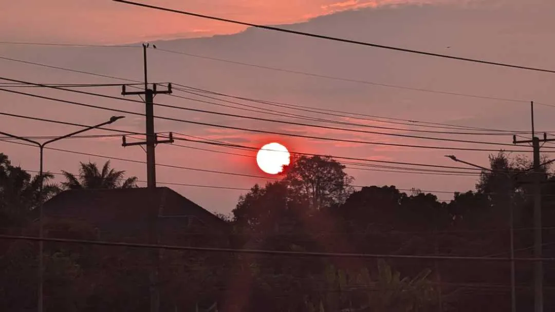 Sunrise over a street in Chiang Mai