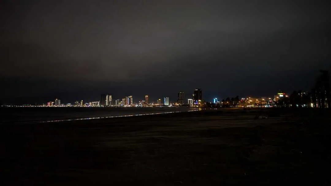 A picture looking over at Da Nang beachside buildings at night