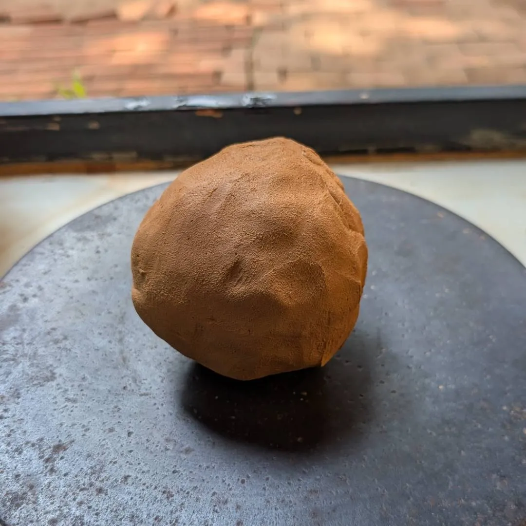 A ball of clay waiting to be crafted