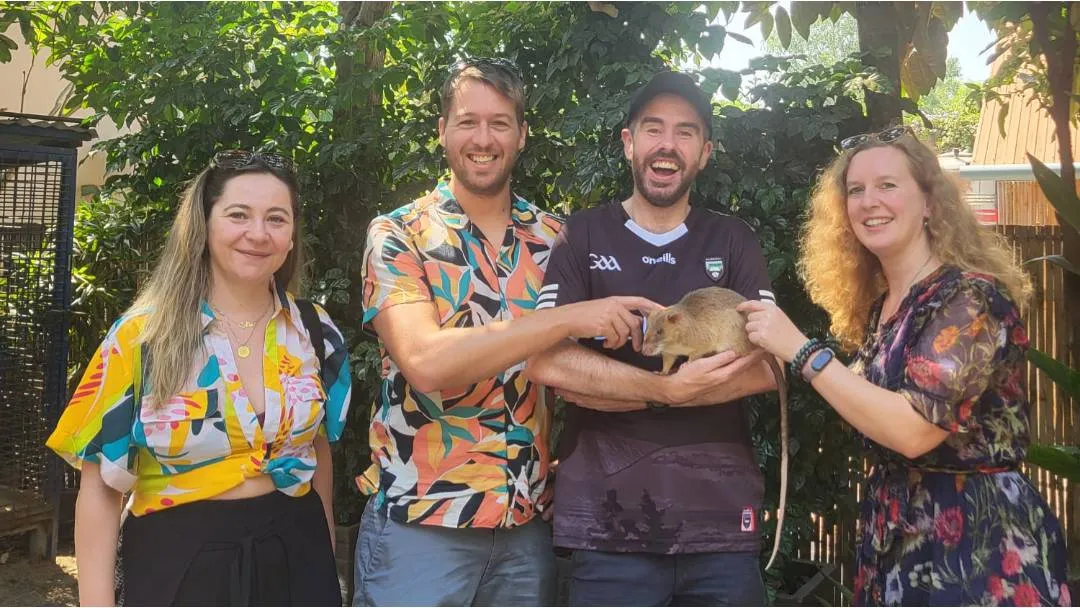 A group picture with a rat that detects landmines