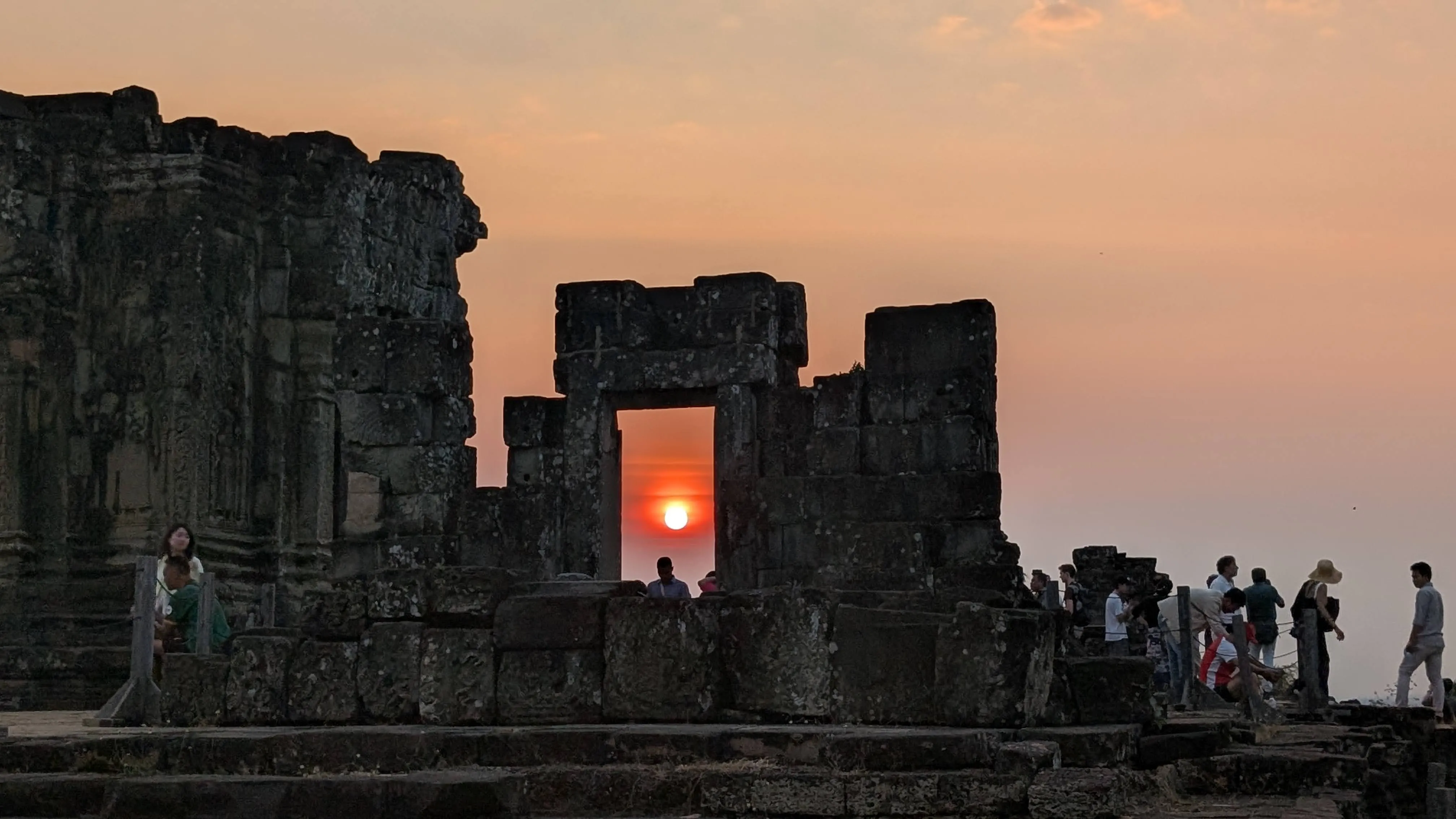 The sun setting at Phnom Bakheng, a temple beside Angkor Wat
