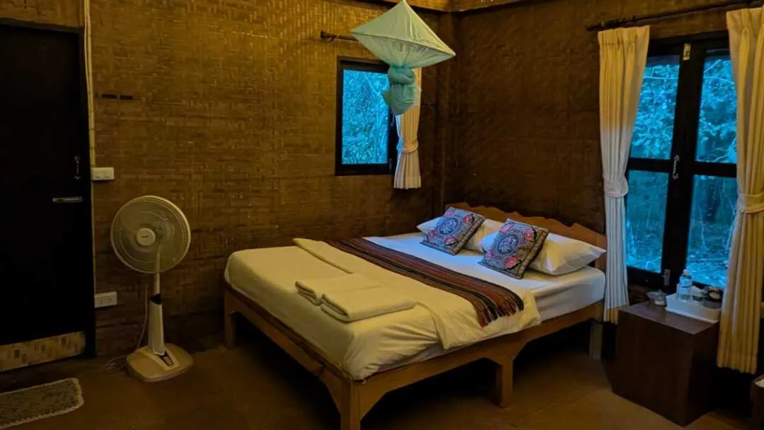 A bed in a room at a resort