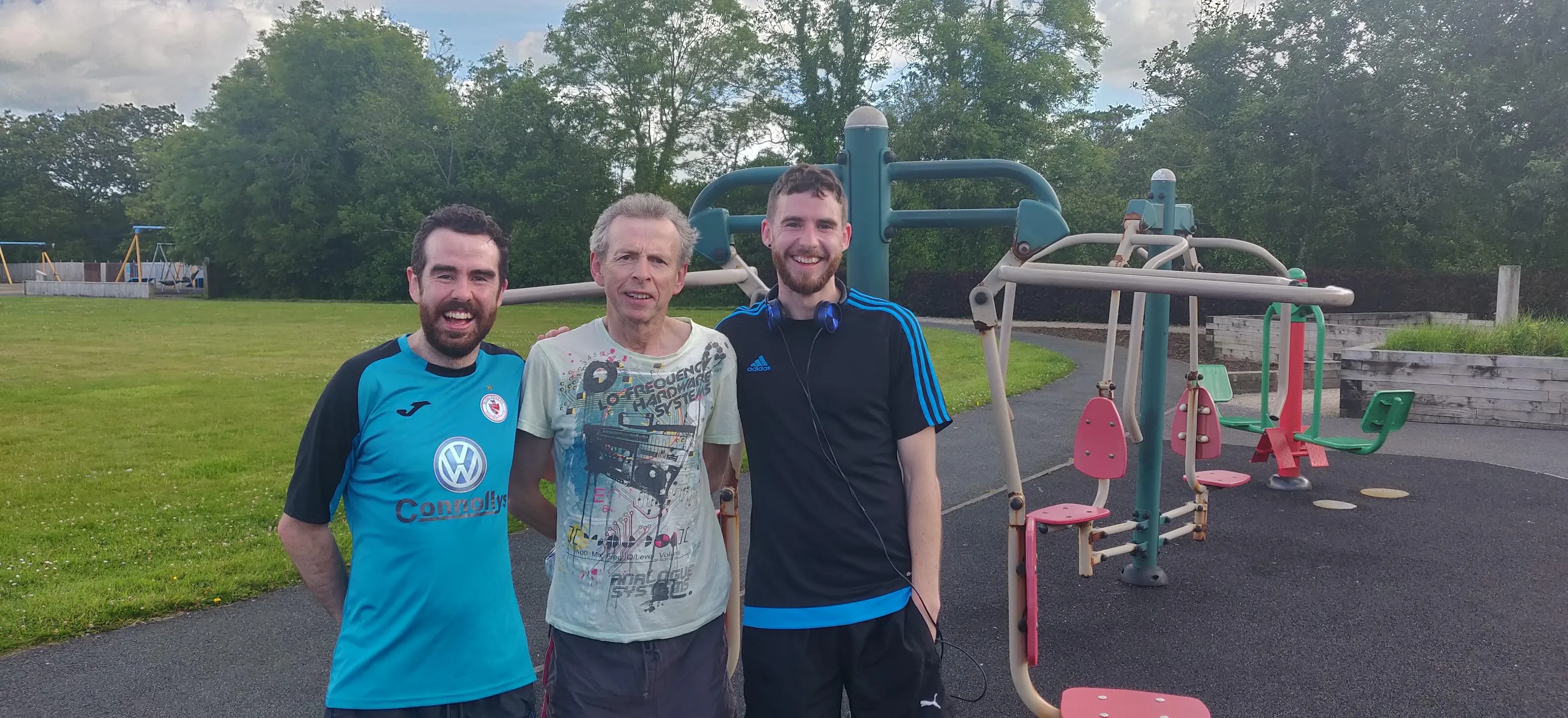 Three people pose for a photo after running a Parkrun