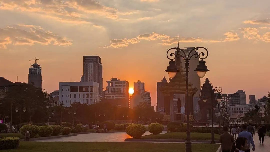 The sun setting amongst the skyscrapers of Phnom Penh