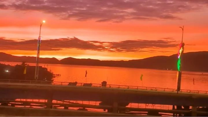 An orange sky and water a the sun rises in Quy Nhon