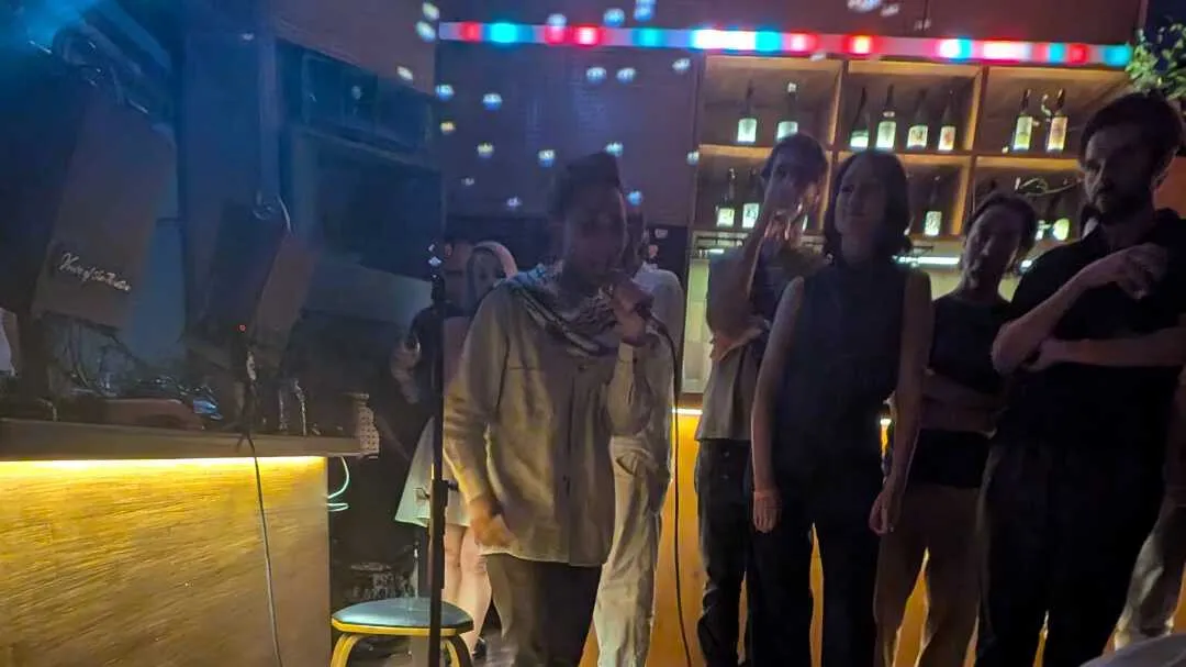 Person performing rap in a pub