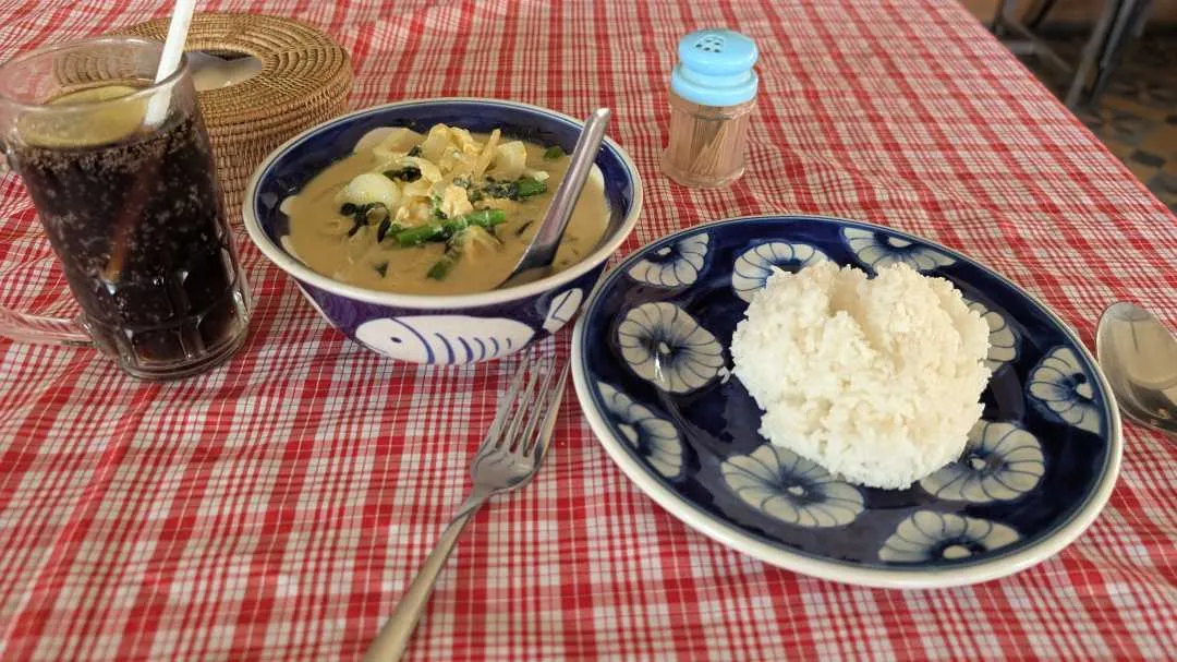 Food at a restaurant showing rice and some Amok