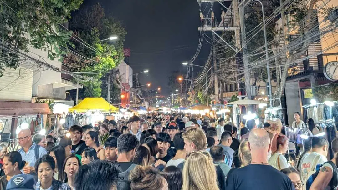 A crowded street of people attending the Sunday Market in Chiang Mai