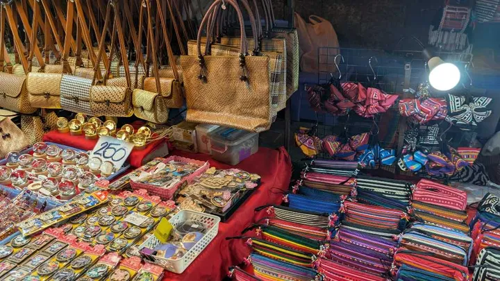 A market stall selling various Thailand souvenirs