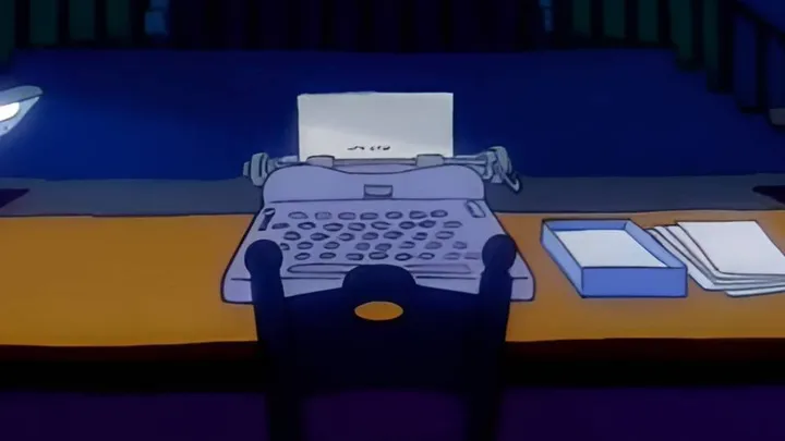A typewriter lit up under a lamp